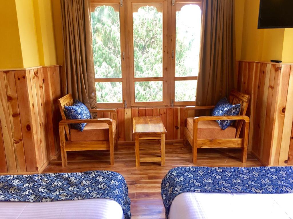 Postel nebo postele na pokoji v ubytování Hotel Khamsum