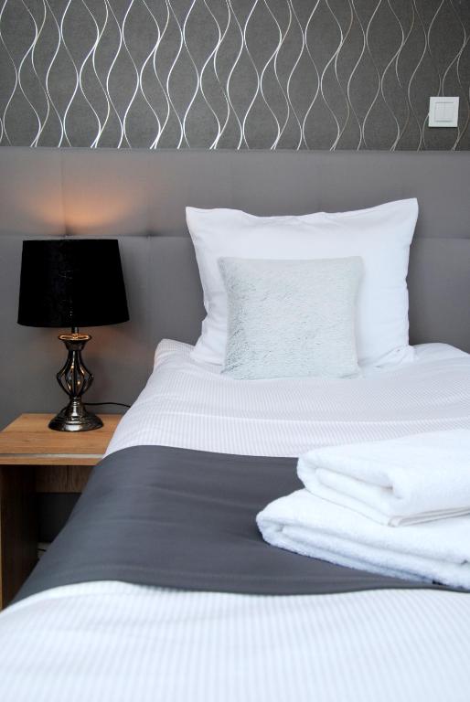 Posteľ alebo postele v izbe v ubytovaní Hotelik 51