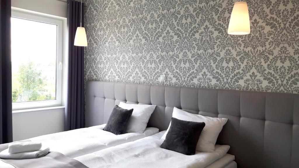 Posteľ alebo postele v izbe v ubytovaní Hotelik 51