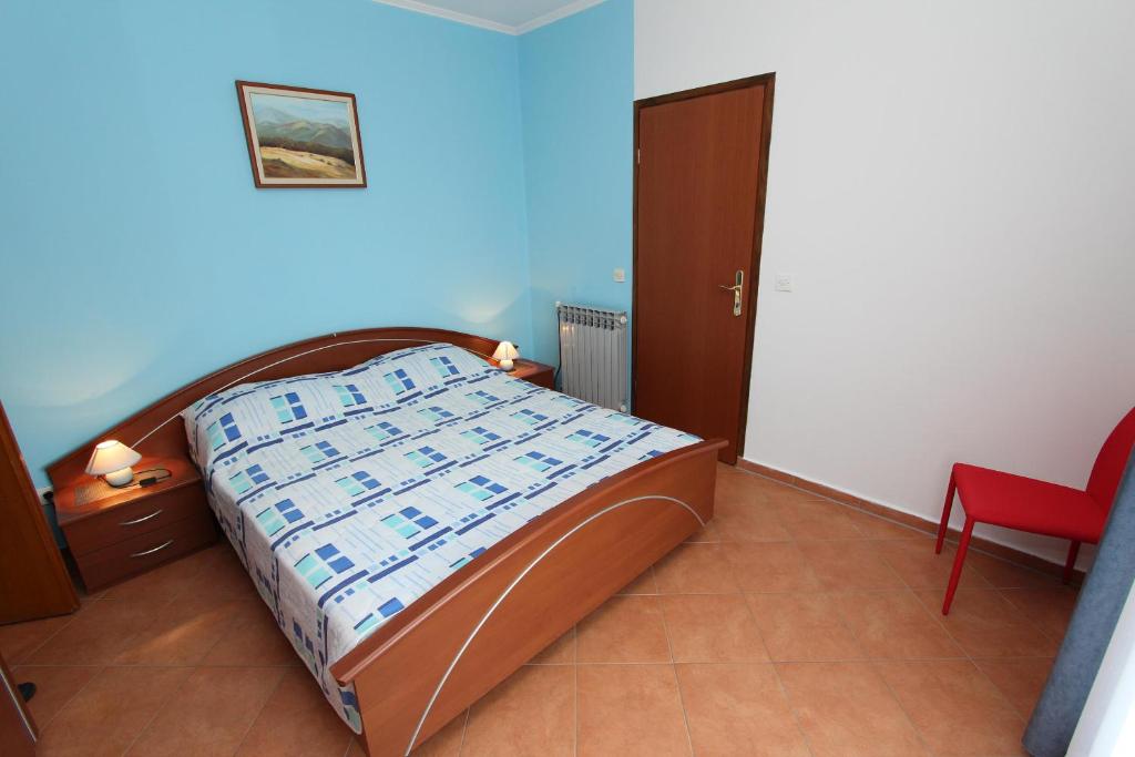 Łóżko lub łóżka w pokoju w obiekcie Apartments Marlina