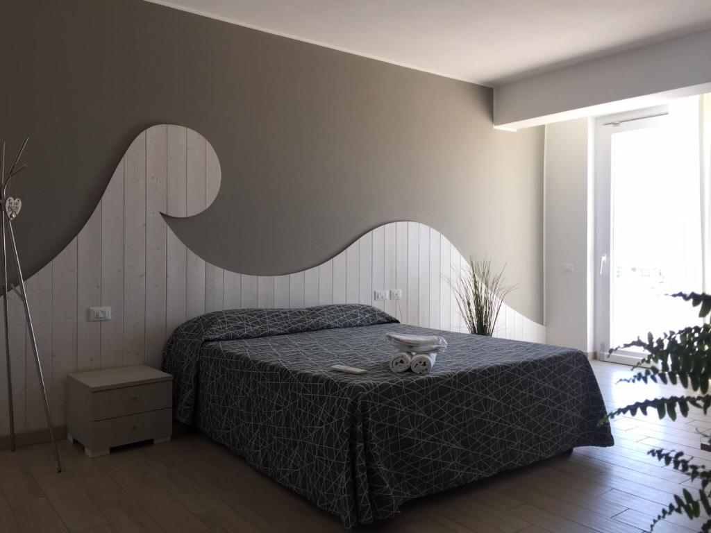 Postel nebo postele na pokoji v ubytování Hotel Letizia
