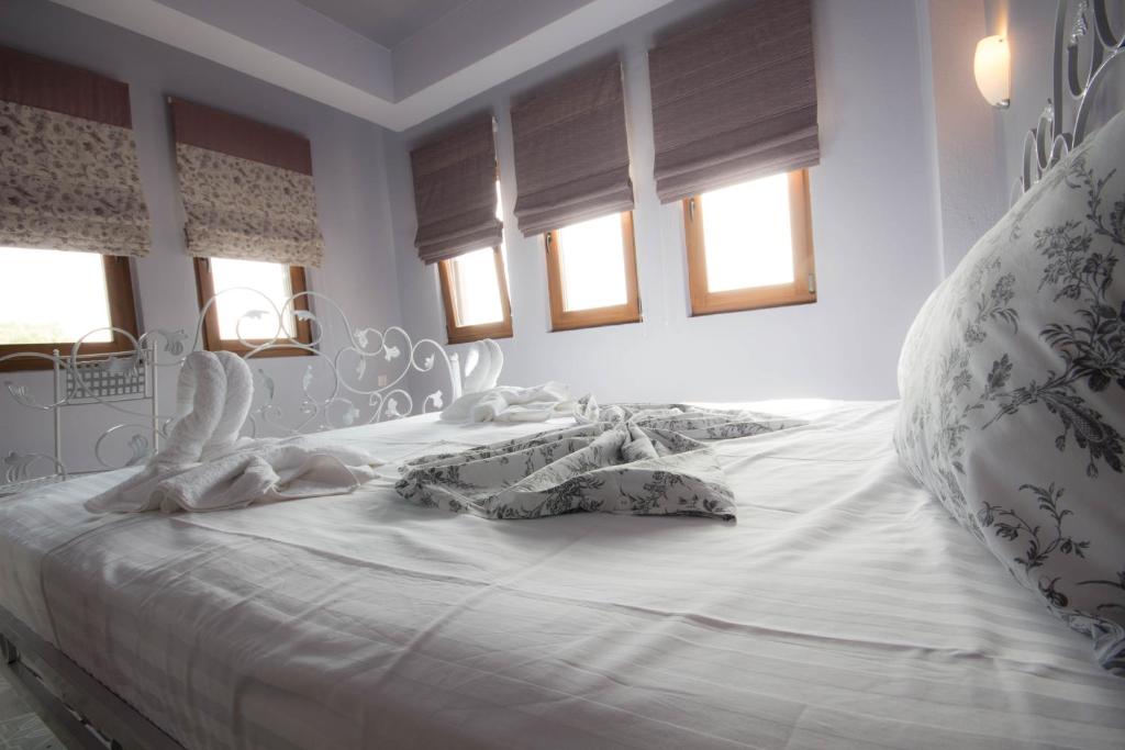 Posteľ alebo postele v izbe v ubytovaní Harmony Deluxe Villas
