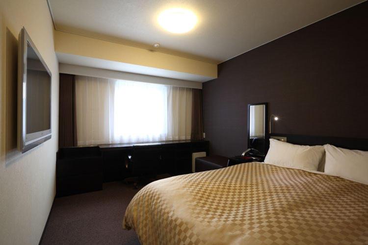 Postel nebo postele na pokoji v ubytování Hotel nanvan浜名湖