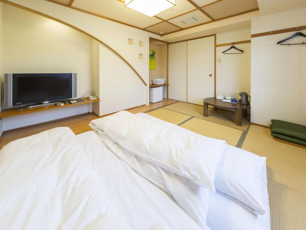 ホテル　港屋にあるベッド
