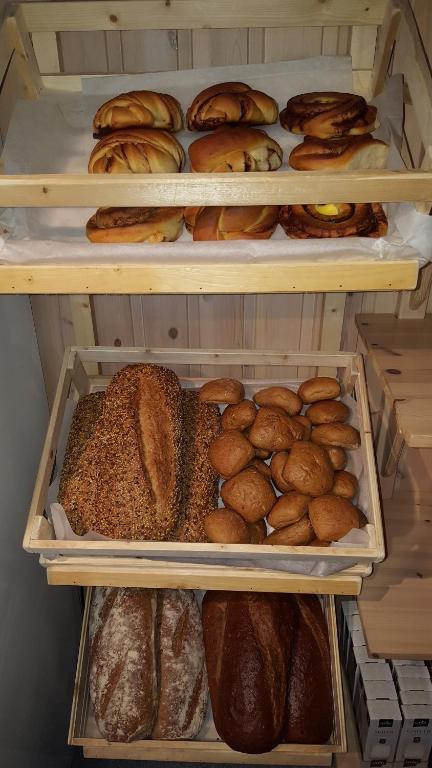 a refrigerator filled with lots of different types of bread at Vinje Camping in Geiranger