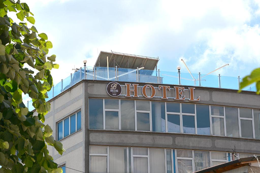 a hotel sign on the top of a building at Bolero Hotel in Ferizaj