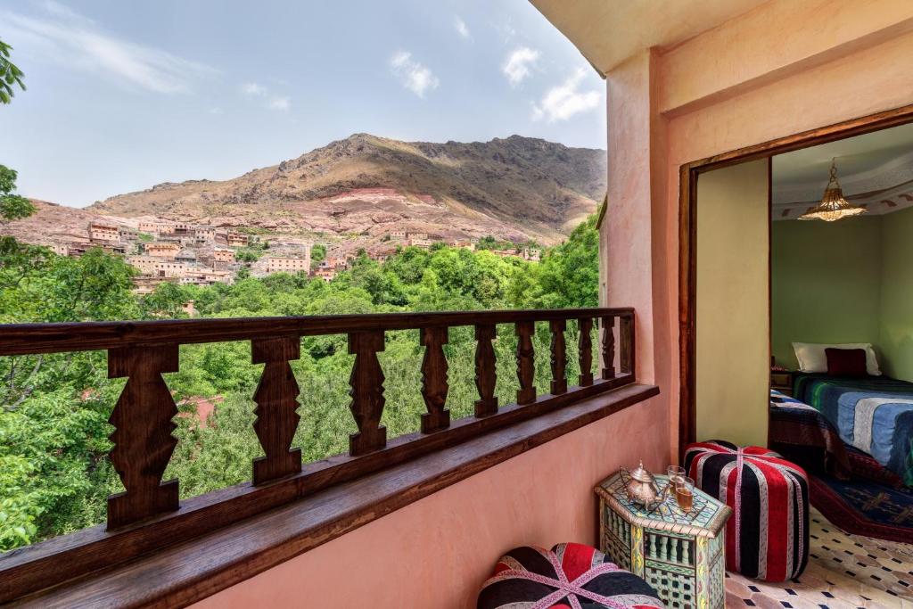a balcony with a view of a mountain at Riad Oussagou in Imlil