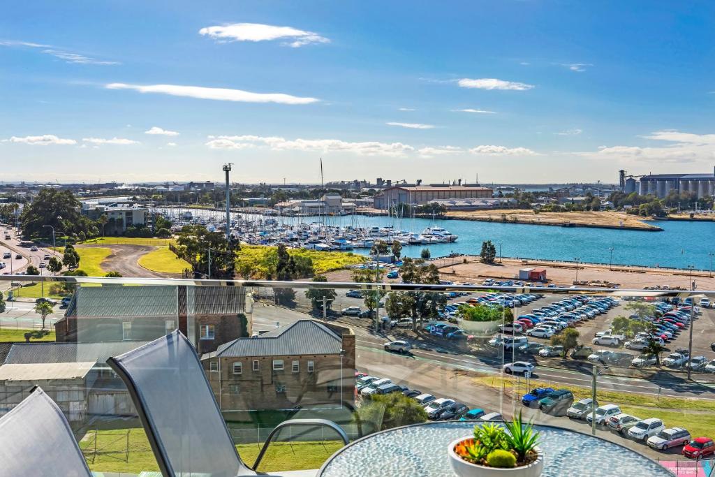 a balcony with a view of a marina at Astra Apartments Newcastle in Newcastle