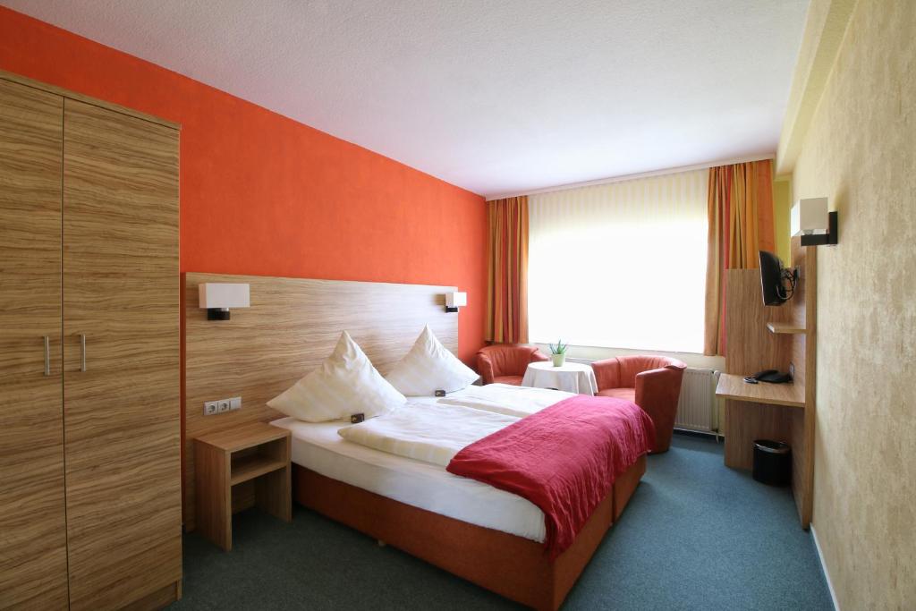 Postel nebo postele na pokoji v ubytování Hotel-Restaurant Weinberg