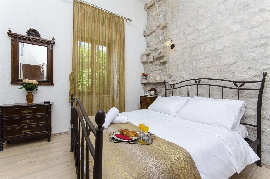 Postel nebo postele na pokoji v ubytování Palace Derossi