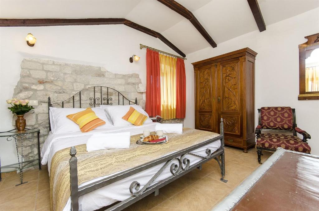 Postel nebo postele na pokoji v ubytování Palace Derossi