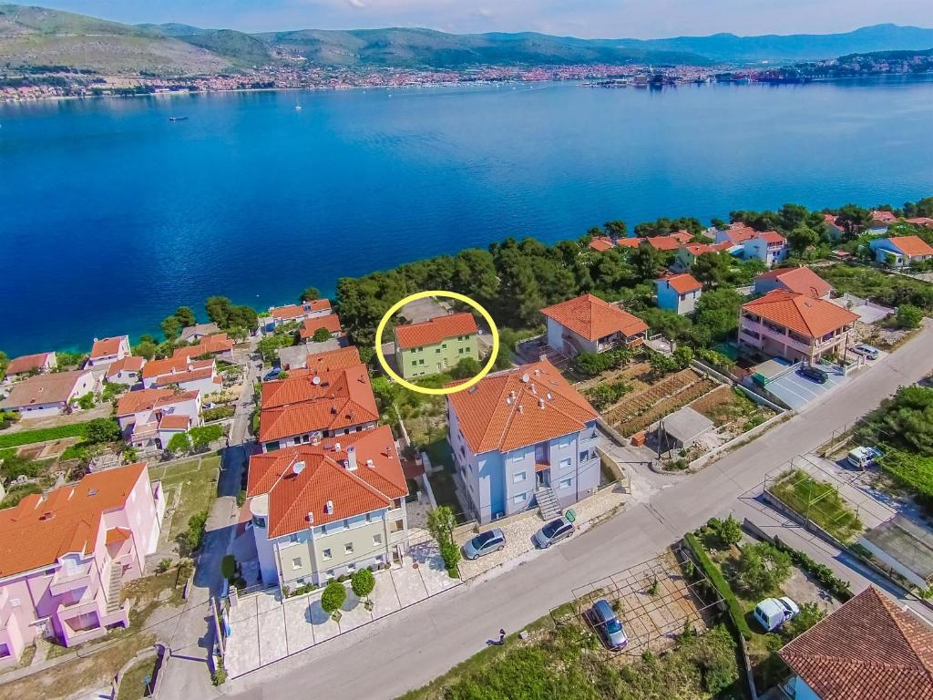 an aerial view of a house with a yellow circle at Apartments Pava in Okrug Donji