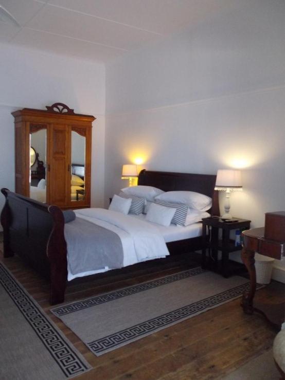 Postel nebo postele na pokoji v ubytování Breeze Inn Guesthouse