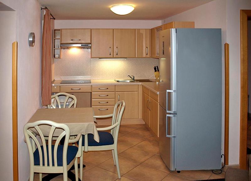 Kuchyň nebo kuchyňský kout v ubytování Apartmány Rosalka