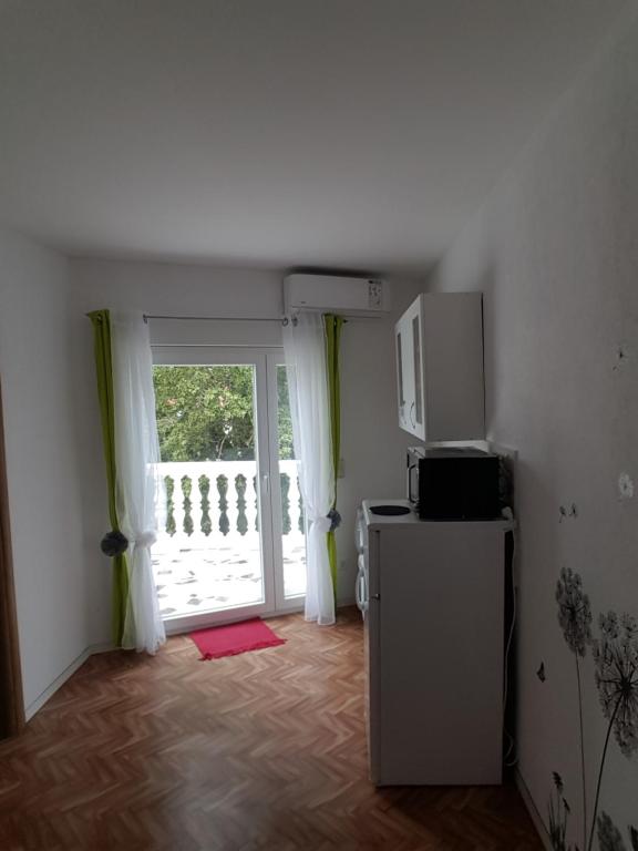 Kuchyňa alebo kuchynka v ubytovaní Apartments Megi