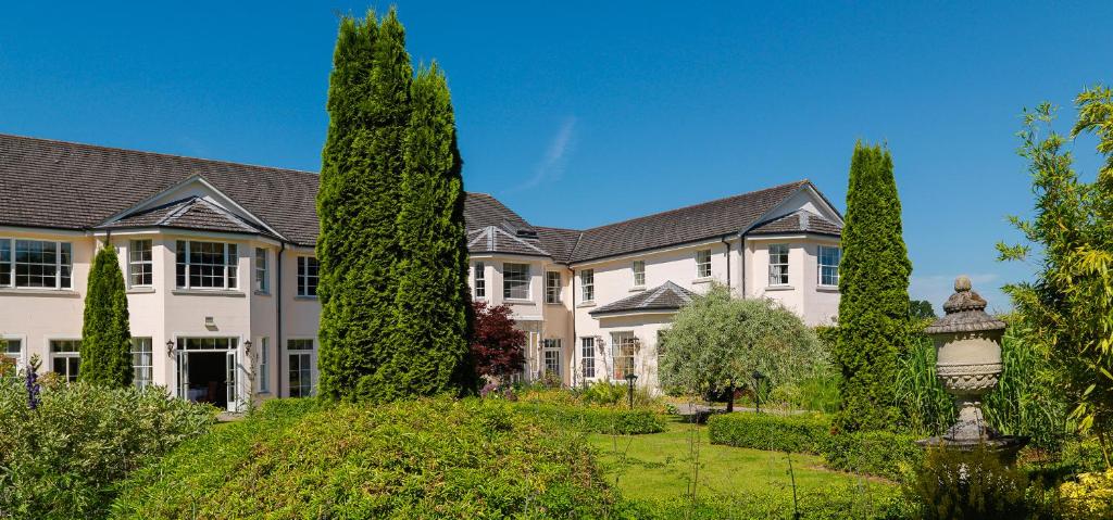 a large house with trees in the yard at Nuremore Estate in Carrickmacross