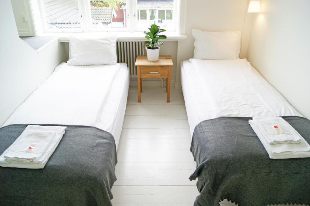 Postel nebo postele na pokoji v ubytování Alvaret Hotel & Hostel