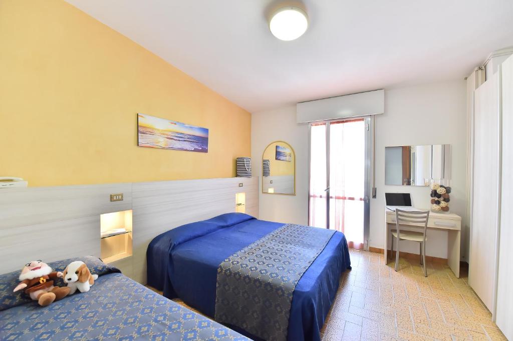 Postel nebo postele na pokoji v ubytování Hotel Della Motta