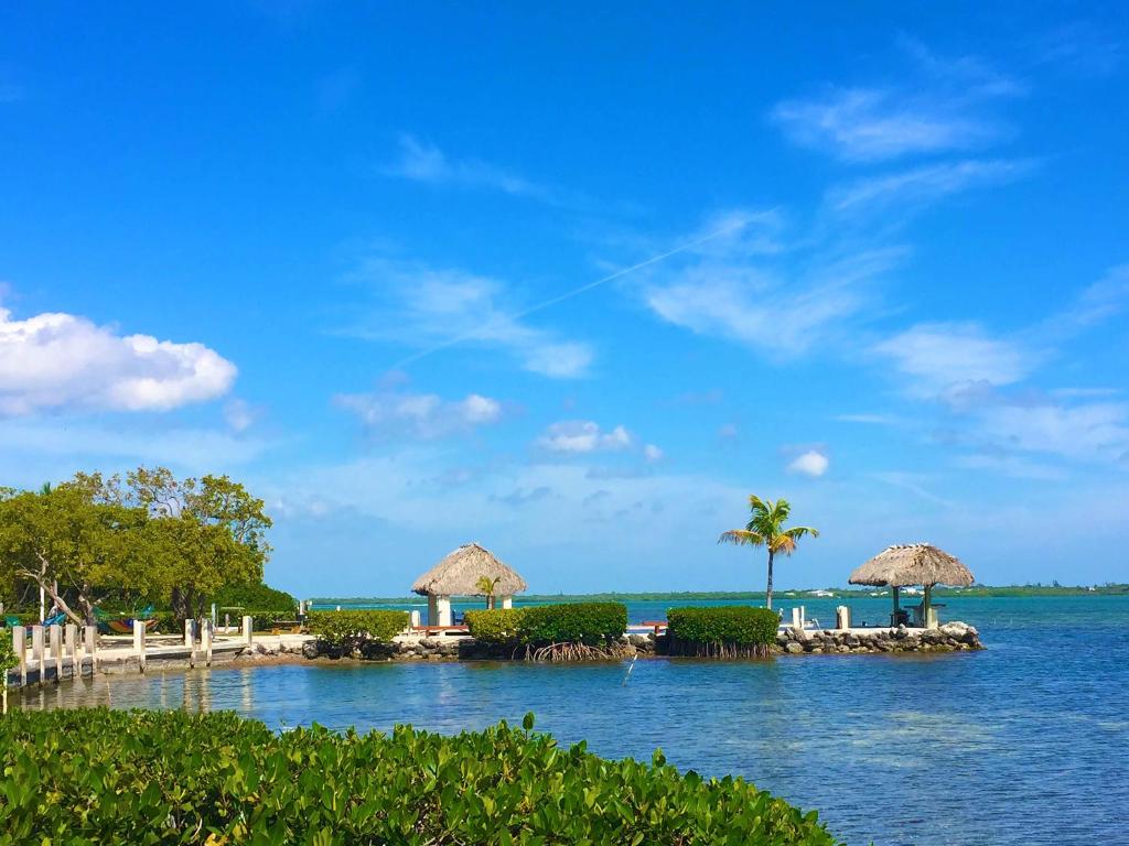 a group of islands with umbrellas and the ocean at Parmer's Resort in Little Torch Key