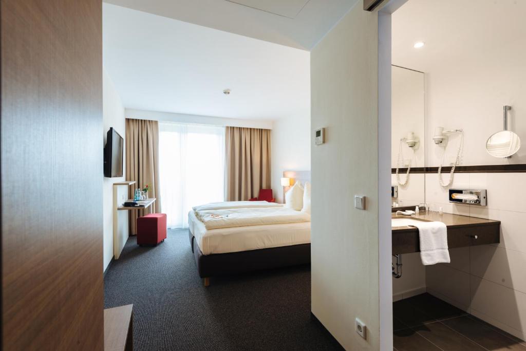Postel nebo postele na pokoji v ubytování Hotel Susato
