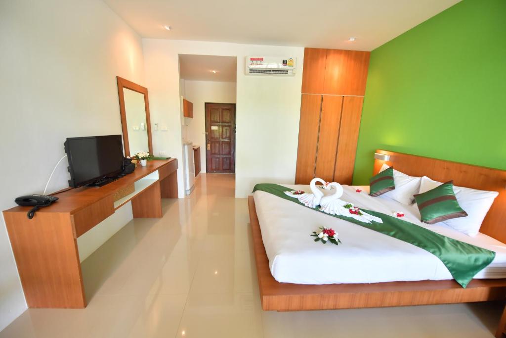 Postel nebo postele na pokoji v ubytování The Touch Green Naiyang Hotel & Fitness