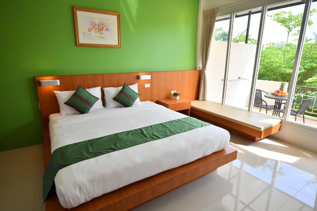 Postel nebo postele na pokoji v ubytování The Touch Green Naiyang Hotel & Fitness
