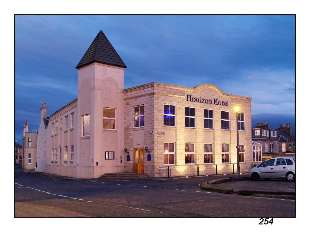 a large building with a clock on the front of it at Horizon Hotel in Ayr