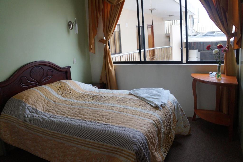 Postel nebo postele na pokoji v ubytování Hostal Pucará