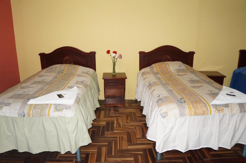 Postel nebo postele na pokoji v ubytování Hostal Pucará