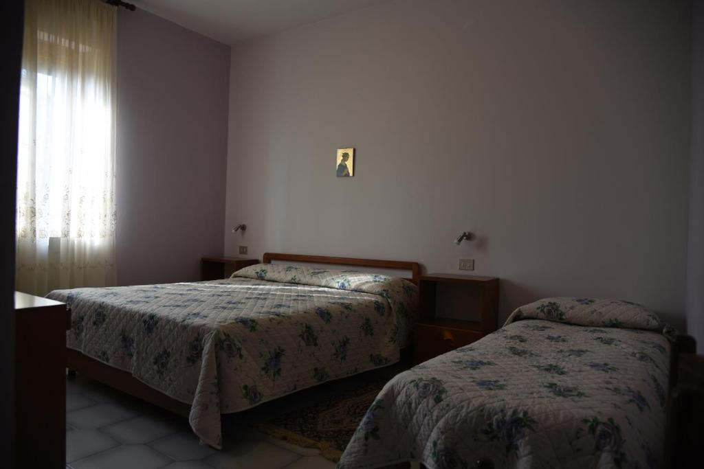 Postel nebo postele na pokoji v ubytování Albergo Dei Bersaglieri