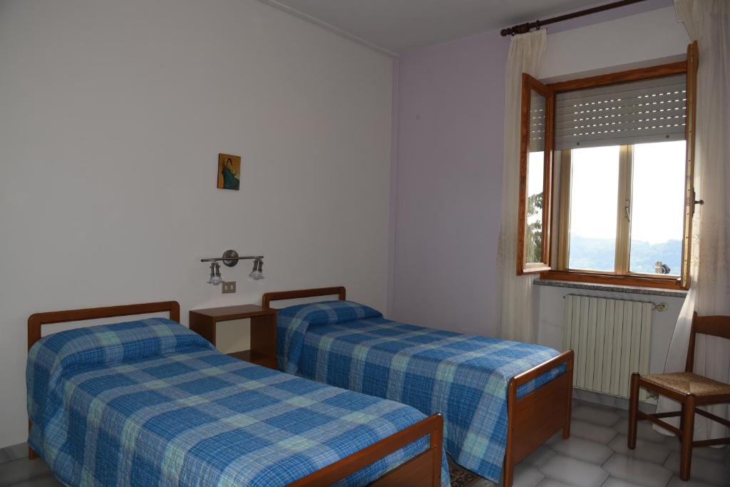 Postel nebo postele na pokoji v ubytování Albergo Dei Bersaglieri