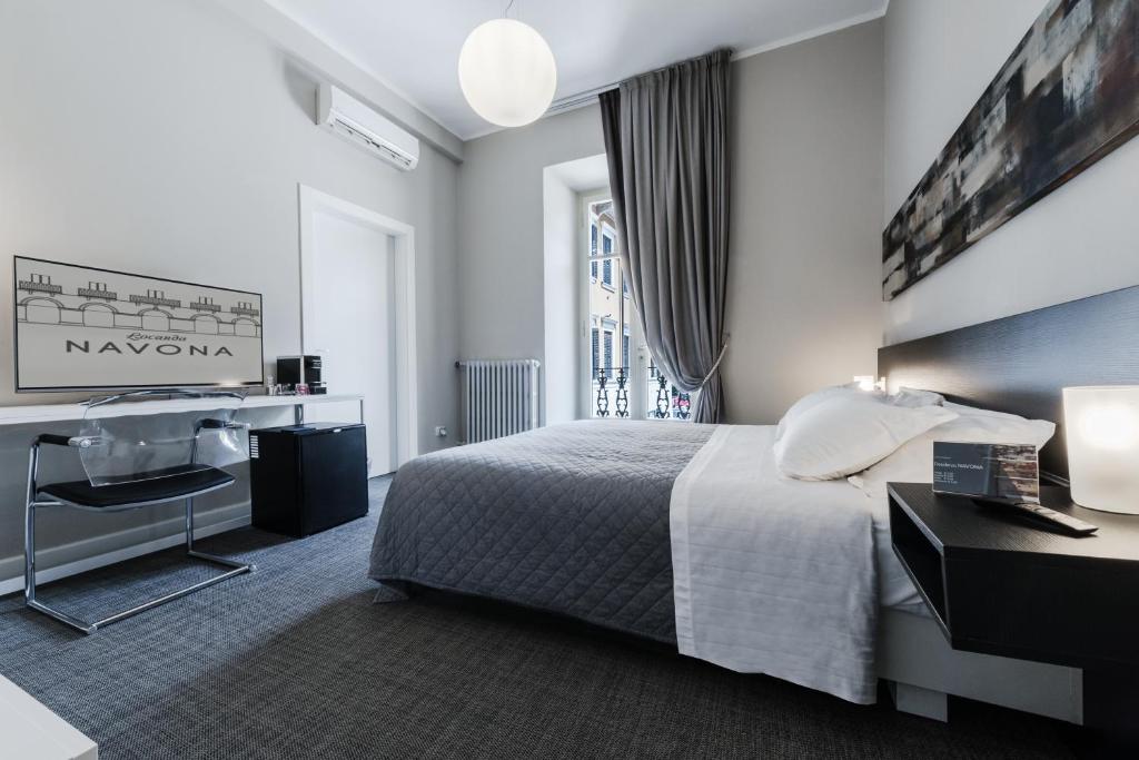 Postel nebo postele na pokoji v ubytování Residenza Navona Verona