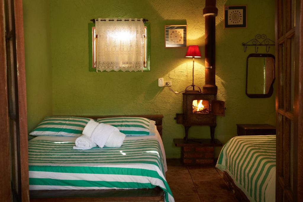Cama ou camas em um quarto em Pousada Janela do Céu