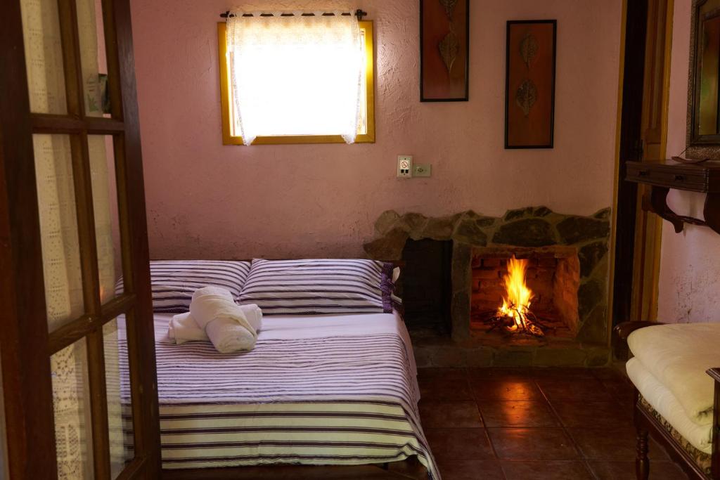Cama ou camas em um quarto em Pousada Janela do Céu