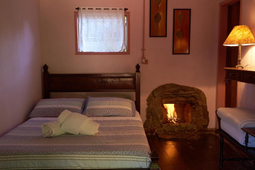 Cama ou camas em um quarto em Pousada Janela do Céu
