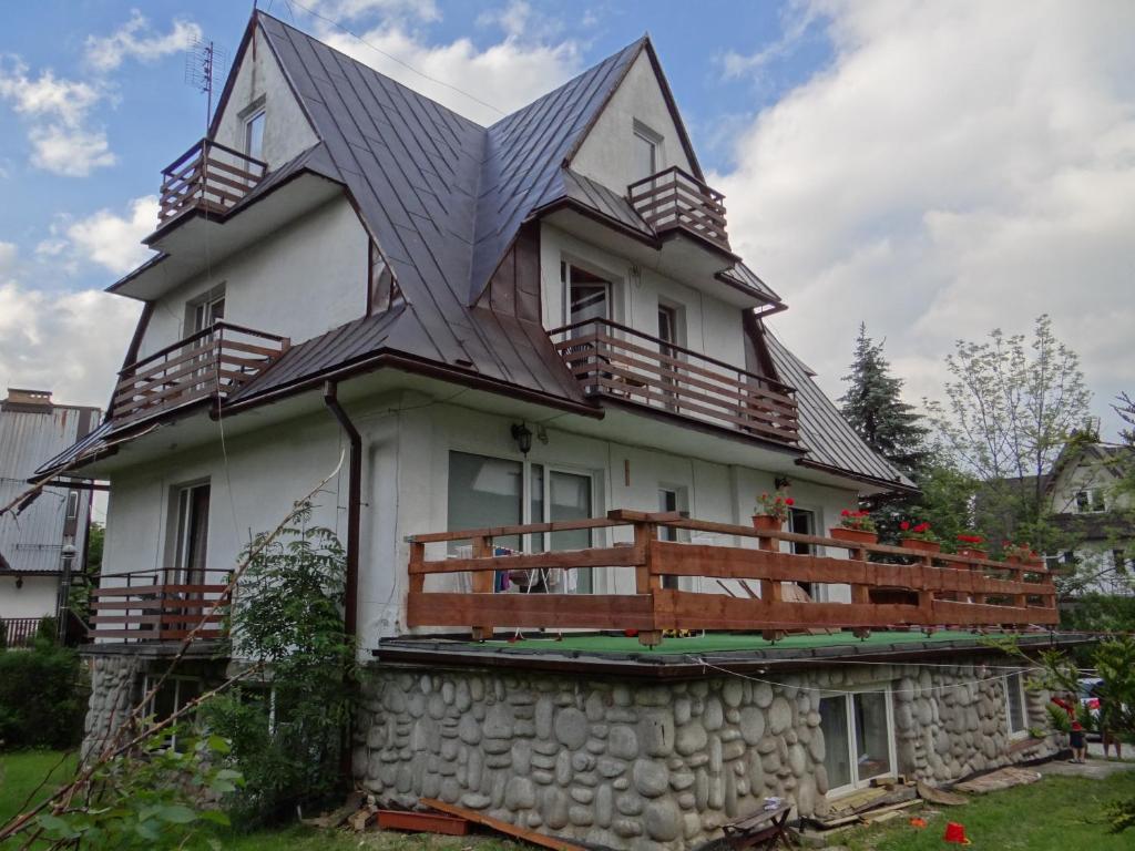 a house with a metal roof on top of it at Stefanka in Zakopane