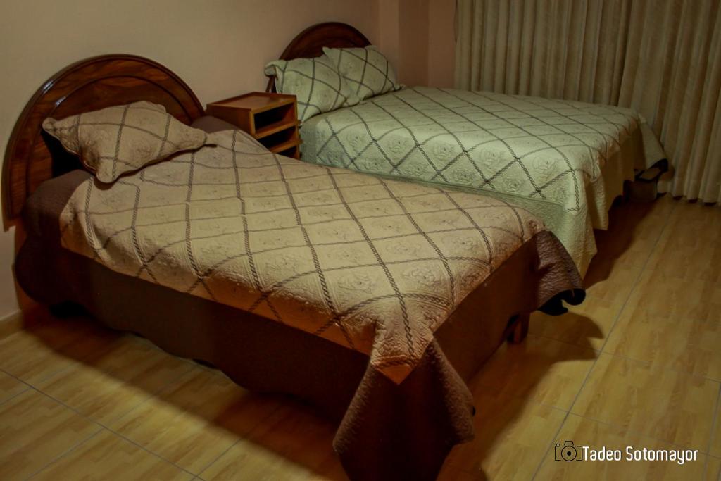 Postel nebo postele na pokoji v ubytování Wisny Inn