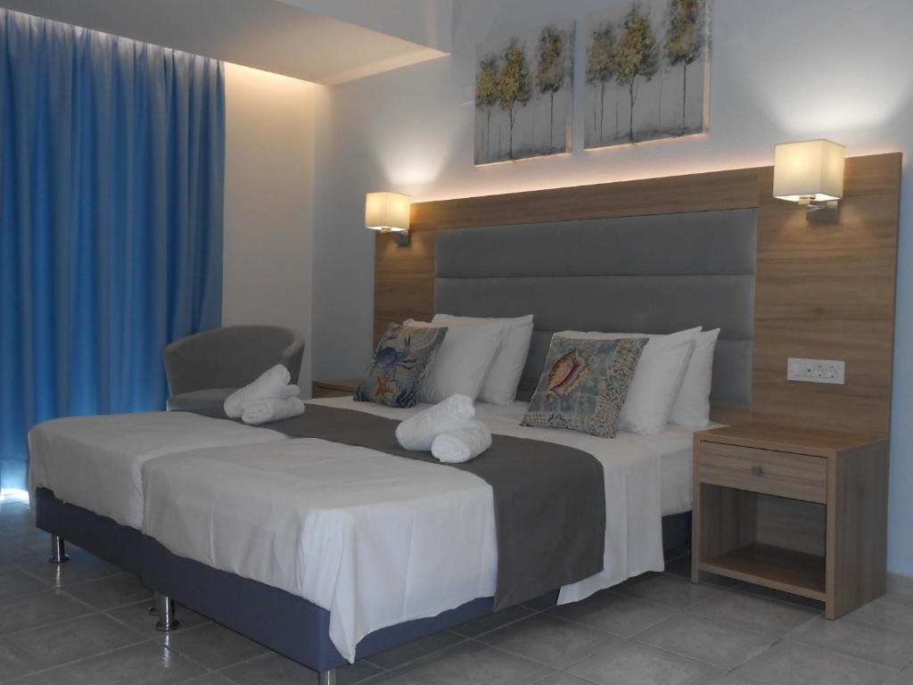Posteľ alebo postele v izbe v ubytovaní Aristo Apts