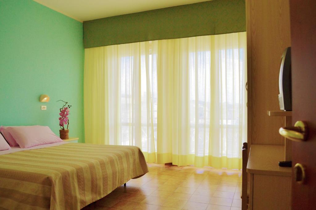 Postel nebo postele na pokoji v ubytování Hotel Solmar