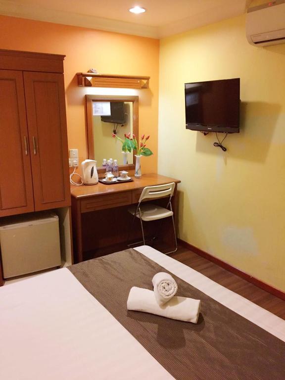 TV a/nebo společenská místnost v ubytování SkyGlobal Hotel