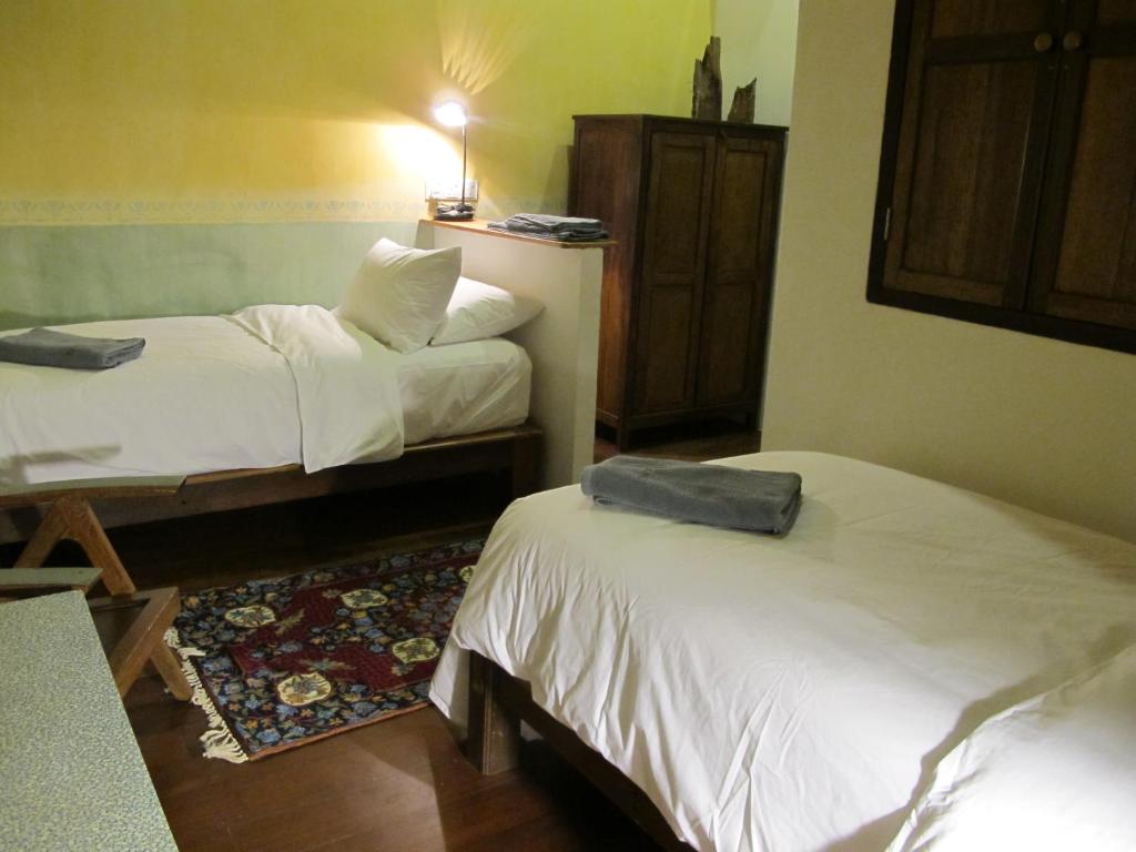 Postel nebo postele na pokoji v ubytování Ren I Tang Heritage Inn