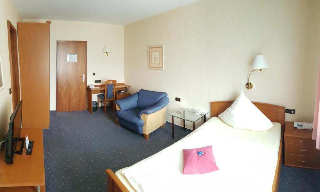 Postel nebo postele na pokoji v ubytování Hotel Vier Linden