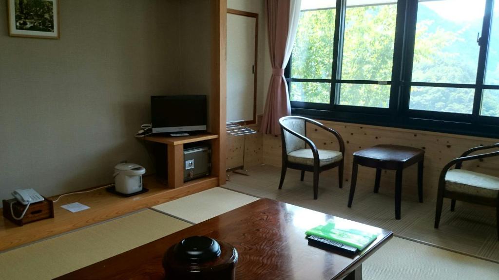 TV a/nebo společenská místnost v ubytování Nezame Hotel