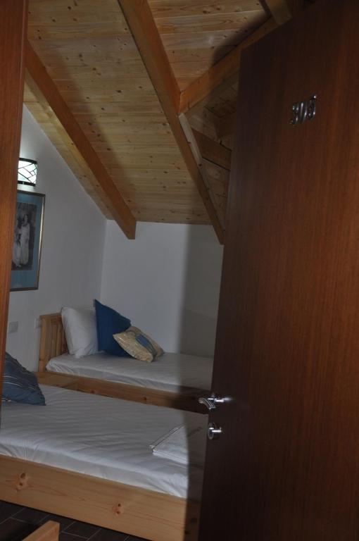 Ein Bett oder Betten in einem Zimmer der Unterkunft Hotel Marub