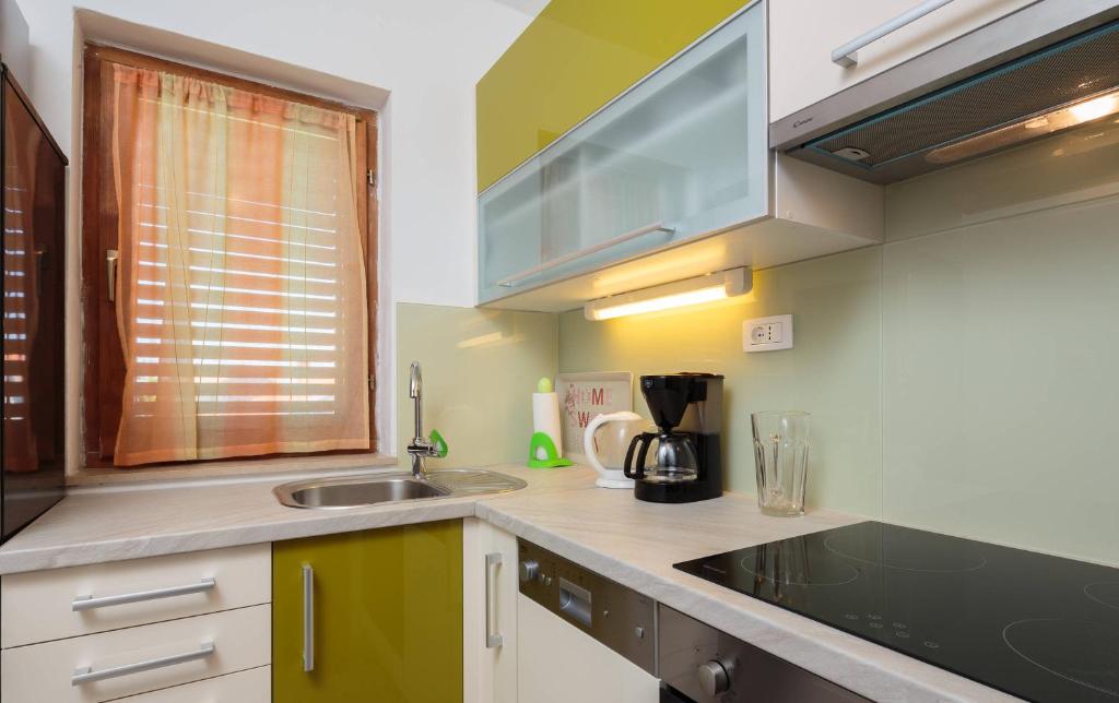 Kuchyňa alebo kuchynka v ubytovaní Apartments Judita