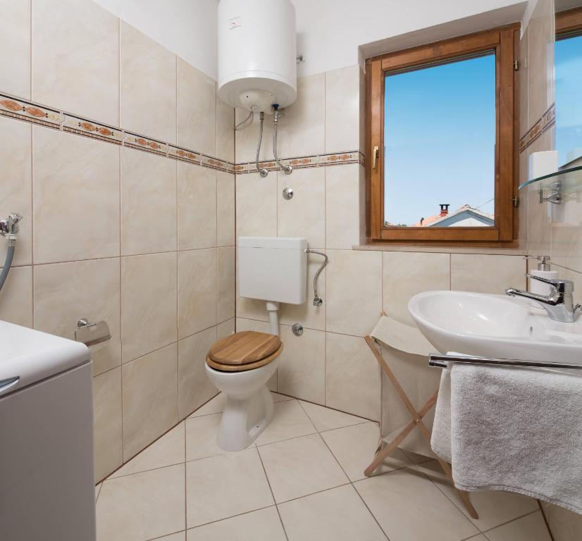 Kúpeľňa v ubytovaní Apartments Judita
