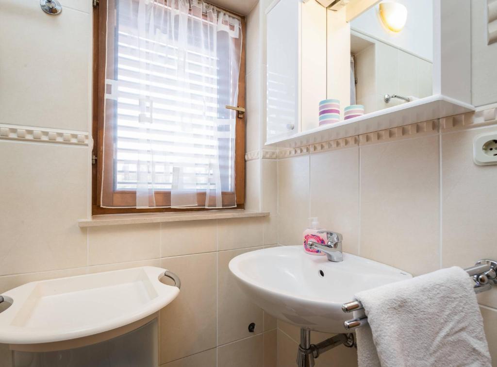 Kúpeľňa v ubytovaní Apartments Judita