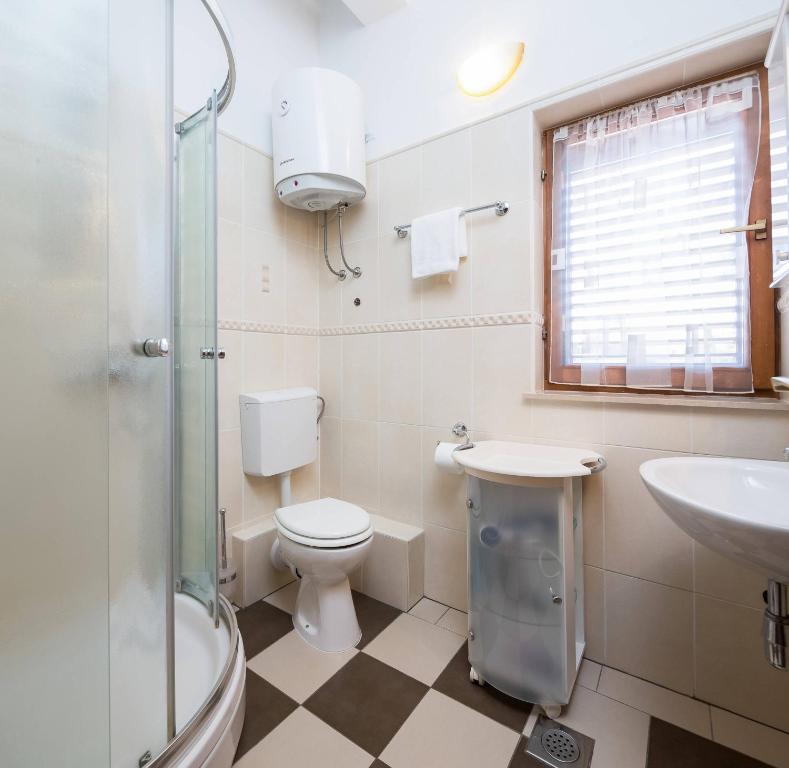 Kúpeľňa v ubytovaní Apartments Judita