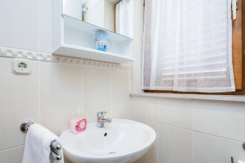 Kúpeľňa v ubytovaní Apartments Judita