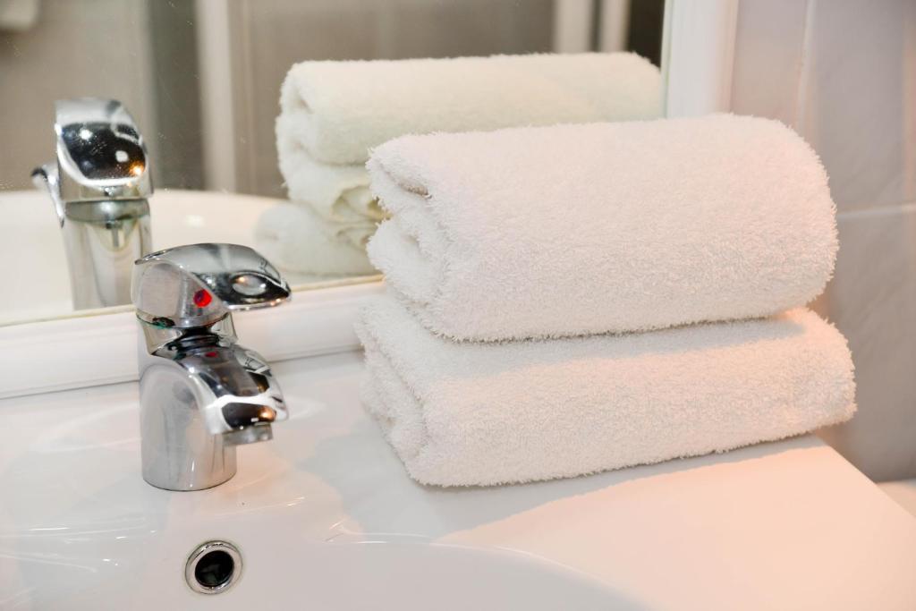 Koupelna v ubytování Astra Hotel